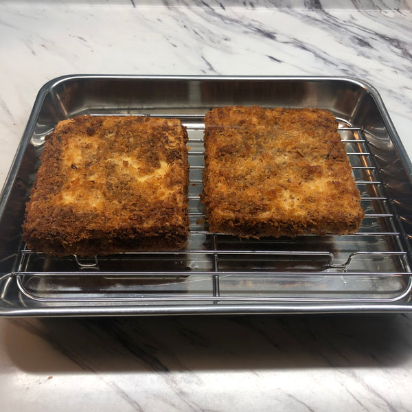 draining the tofu katsu on a draining rack