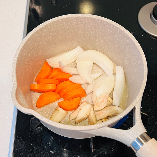 sauteing the onions and carrots
