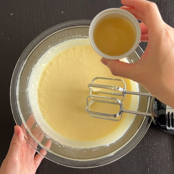 adding the yuzu juice to the cream cheese mixture