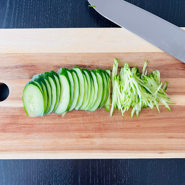 cutting the cucumbers into matchsticks