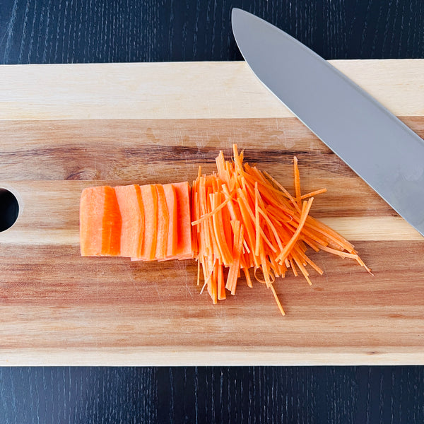 cutting the carrots into matchsticks