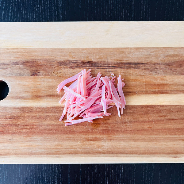 cutting the ham into matchsticks