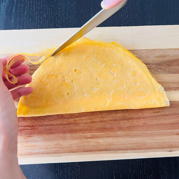 cutting the ends off of the egg sheet