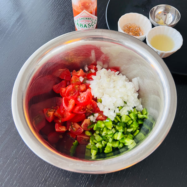 adding the salsa ingredients to a bowl