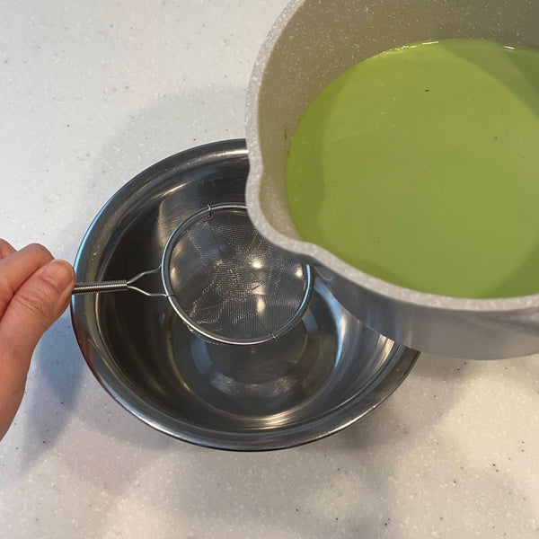 straining the matcha mixture for a better texture