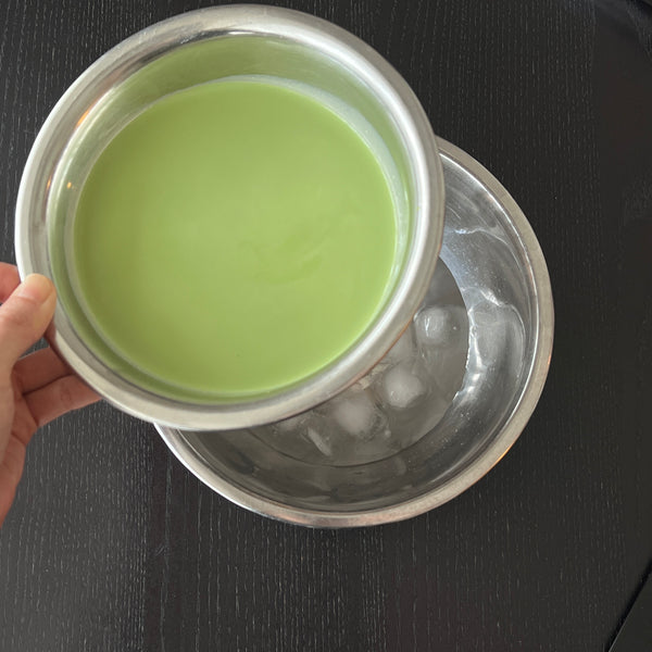 chilling the matcha mixture over a bowl of ice water